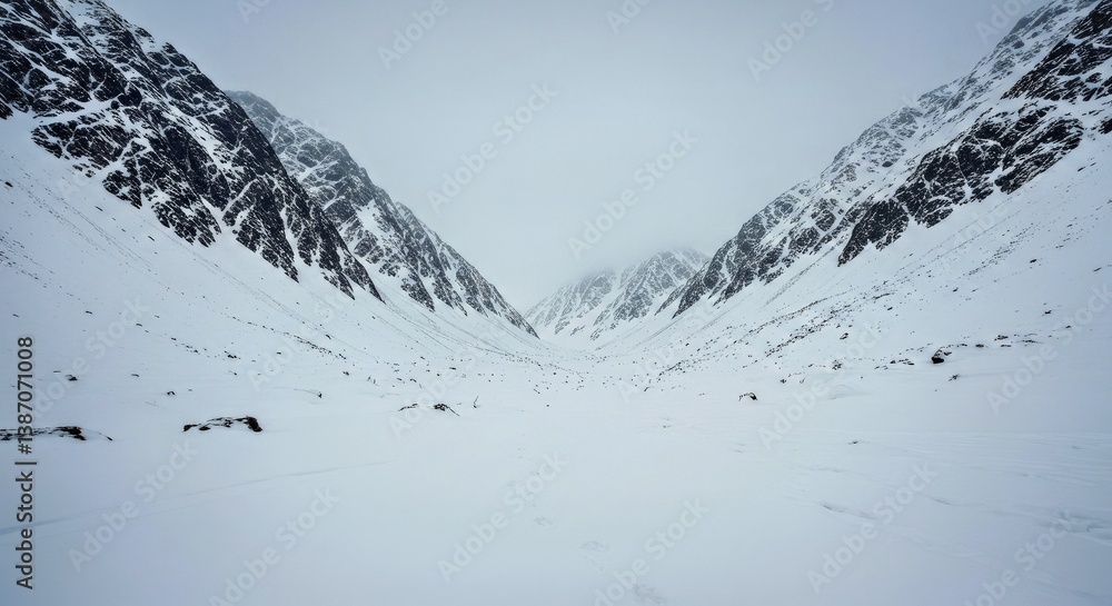Obraz premium A Remote, Uncharted Mountain Wilderness Covered in Deep Snow and Frost