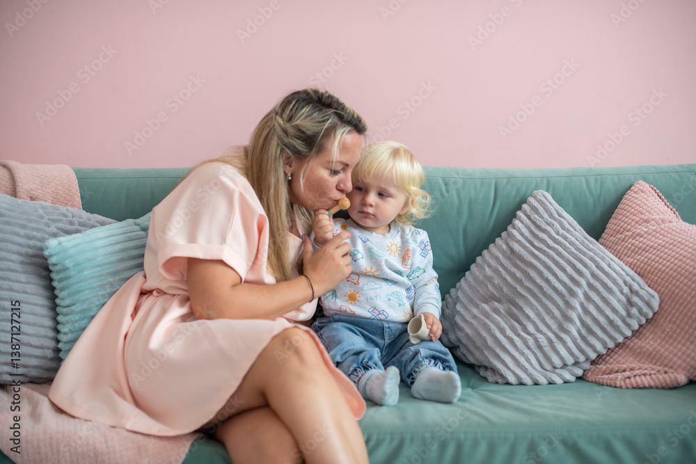 Happy mother and baby have fun at home. Smile, happiness and parental care in the house with mother's love and bonding with the baby. Happy mother and baby have fun at home. Smile, happiness and parental care in the house with mother's love and bonding with the baby.
