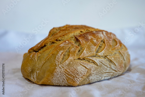 Freshly baked home made bread on a white background.