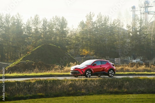 Obraz na płótnie Vehicle cruising through forest at sunset w salonie