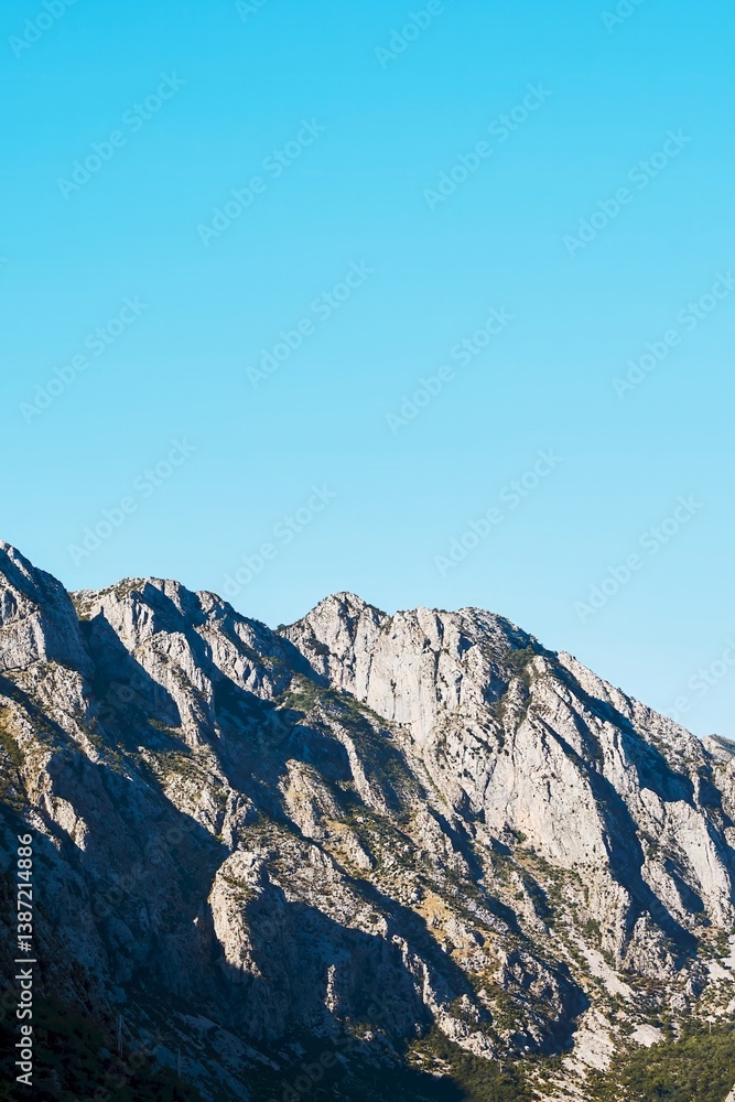 Rugged mountains reflecting on Kotor Bay waters