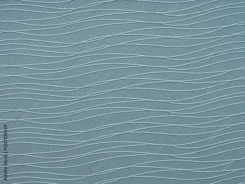 Slate gray waves on paper create a rhythmical pattern, soothing in its repetitive, undulating flow