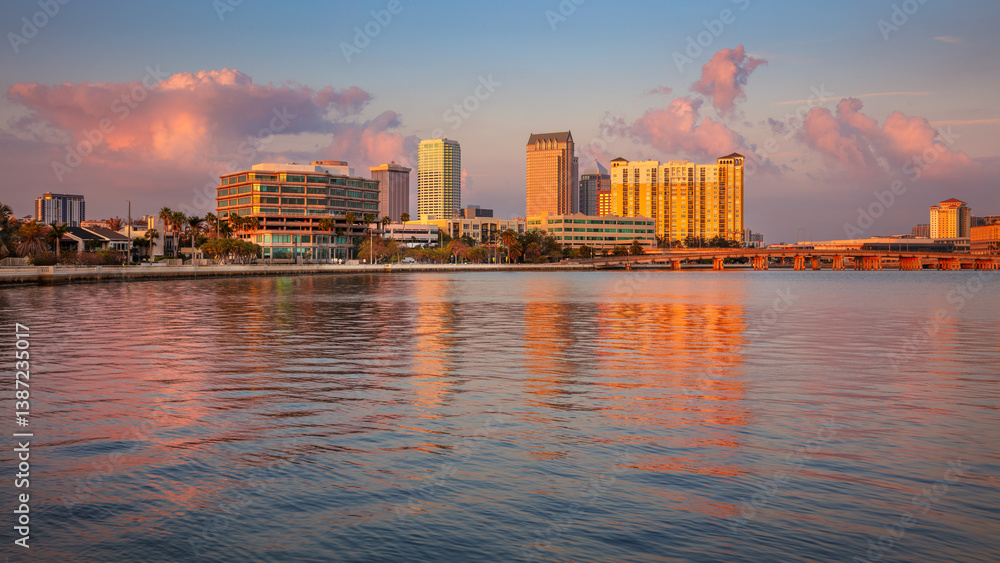 Tampa, Florida, USA. Cityscape image of Tampa, Florida with reflection of the city skyline in the water at beautiful sunset.