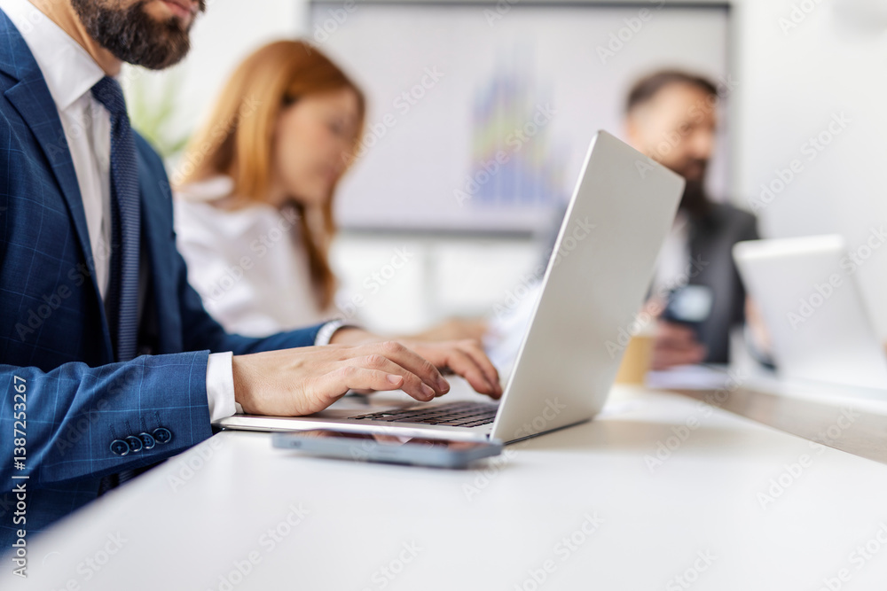 Close up of businessman's hands typing on laptop during the meeting in meeting room. Close up of businessman's hands typing on laptop during the meeting in meeting room.