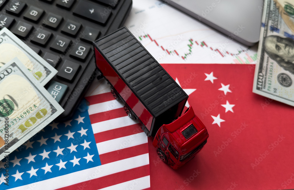 Chip shortage and US-China trade conflict. Global chip shortage crisis and China-United States trade war concept. China flag and US flag on china map and hand holding computer chip on background.