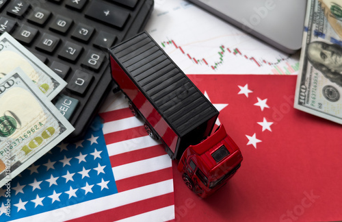 Obraz na płótnie Chip shortage and US-China trade conflict. Global chip shortage crisis and China-United States trade war concept. China flag and US flag on china map and hand holding computer chip on background. w salonie