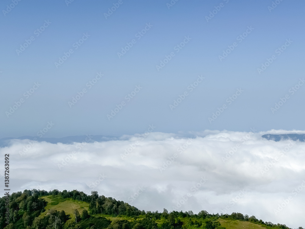 idyllic countryside view, a scenic lush green hill with white fluffy clouds and clear blue sky forms a picturesque horizon idyllic countryside view, a scenic lush green hill with white fluffy clouds and clear blue sky forms a picturesque horizon