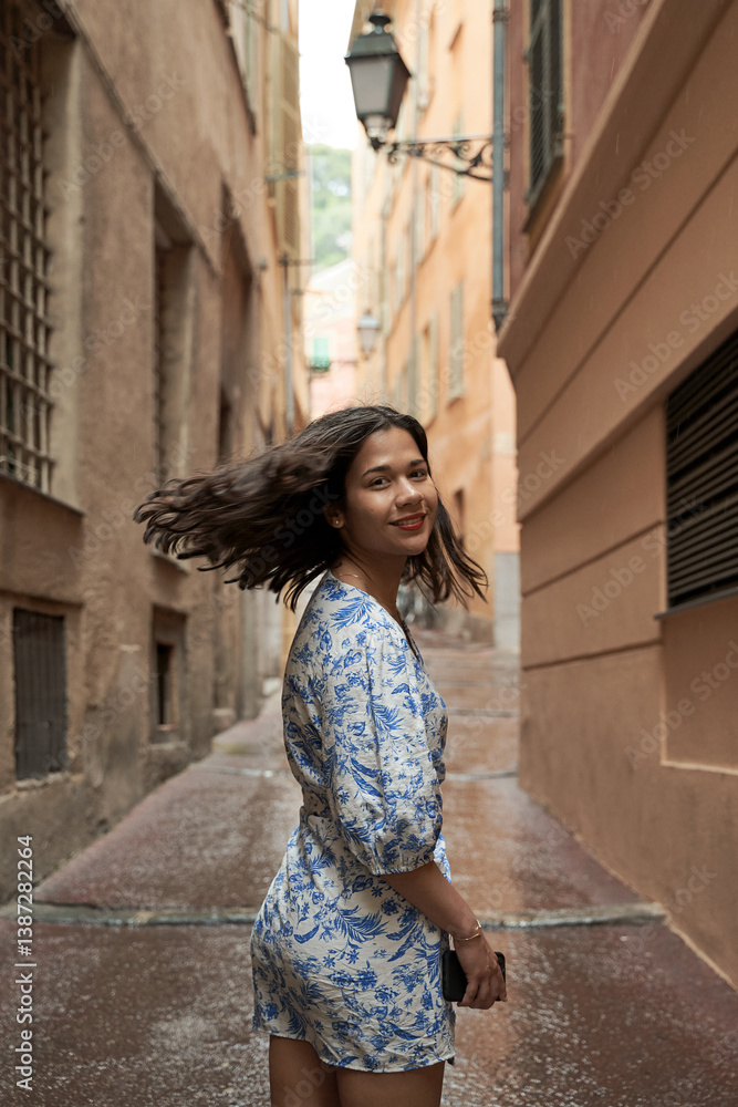 Beautiful young mixed race woman in the old town of Nice, France