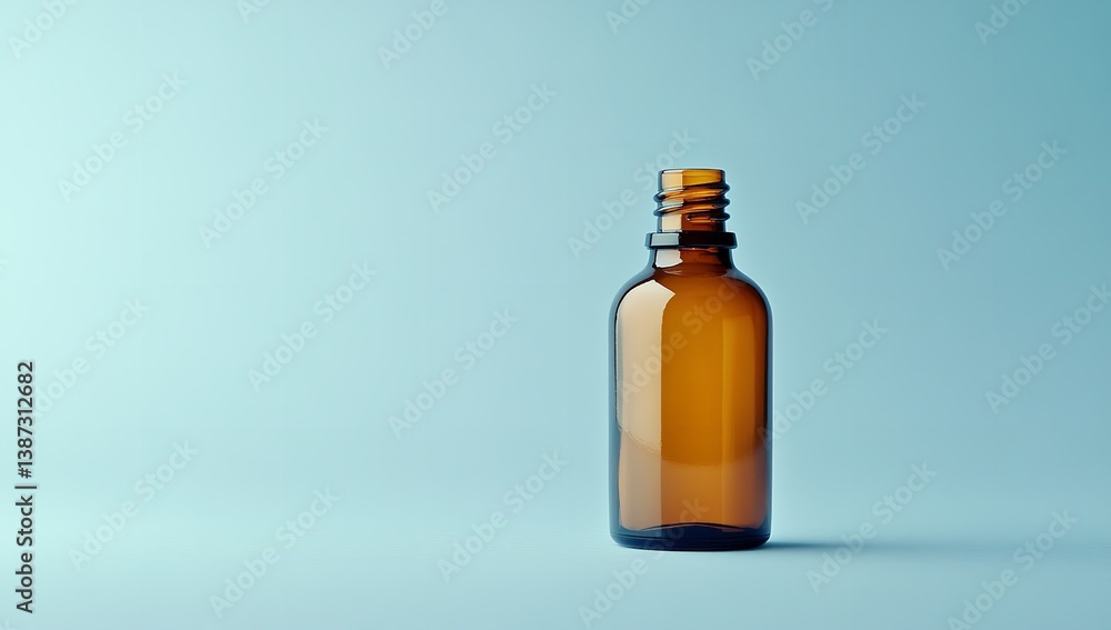 Brown Glass Bottle with Light Blue Background and Copy Space Brown Glass Bottle with Light Blue Background and Copy Space