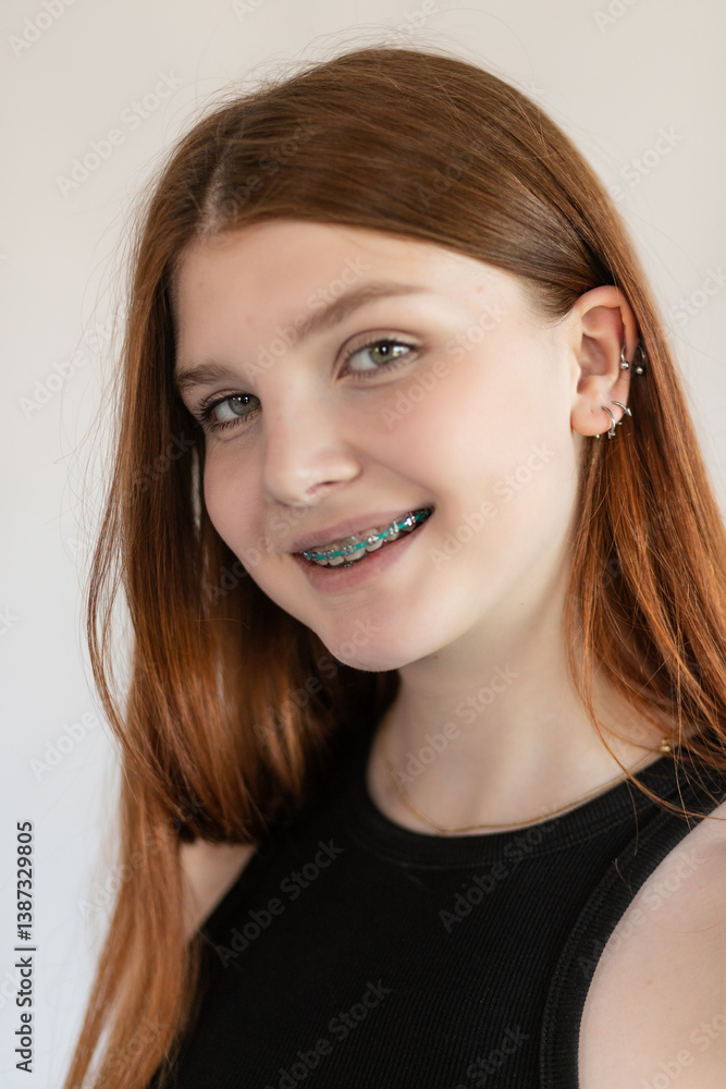 Portrait red-haired girl with freckles and braces Portrait red-haired girl with freckles and braces