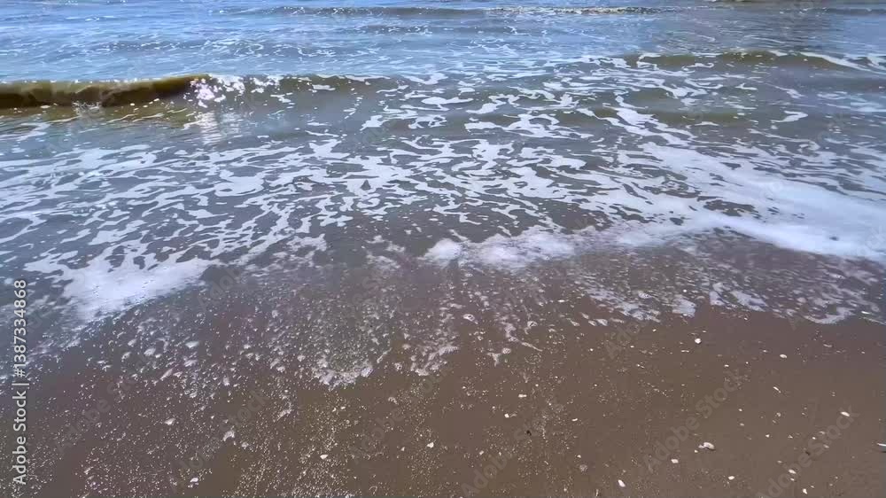 Foamy Waves Touching the Beach Shoreline Foamy Waves Touching the Beach Shoreline