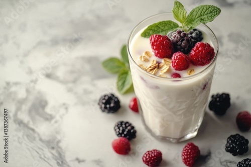Obraz na płótnie Tasty and refreshing berry milk smoothie with fresh raspberries, blueberries, and ice cream. w salonie