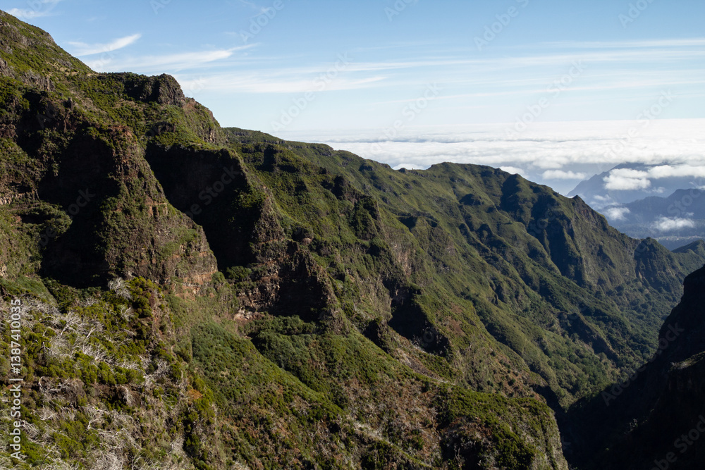 Traversing the Pico de Ruivo to Pico do Arieiro trail offers hikers expansive views of Madeira's mountainous terrain. Traversing the Pico de Ruivo to Pico do Arieiro trail offers hikers expansive views of Madeira's mountainous terrain.