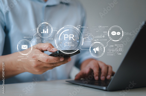 Businessman using laptop with public relations on virtual screen for marketing strategy, public relations concept, communication, advertising, marketing.