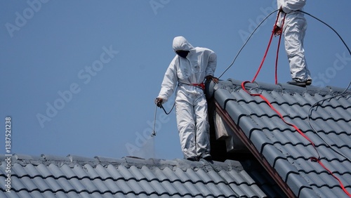 Wallpaper Mural House painter standing on roof spray painting Torontodigital.ca