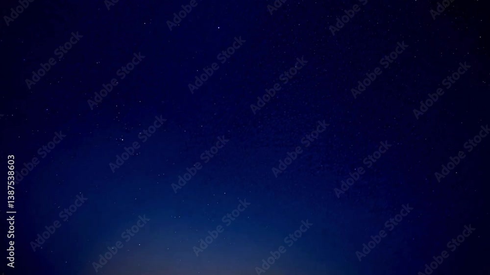 Cinematic 4K time-lapse of stars drifting across the night sky, capturing the mesmerizing celestial motion, deep blue hues, and cosmic beauty of the universe.