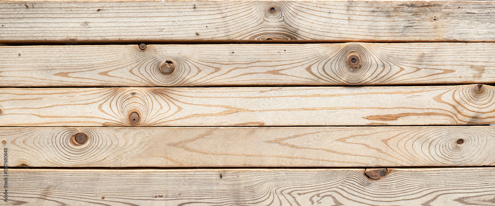 Naklejka premium Weathered driftwood planks showcasing rustic beauty, natural aesthetics