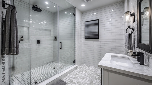 Sleek bathroom with white subway tiles and glass shower enclosure