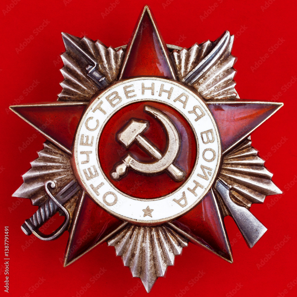 Fototapeta premium Soviet Order of the Patriotic War on a red background. Symbol victory in World War II. Translation of the Russian inscriptions: 