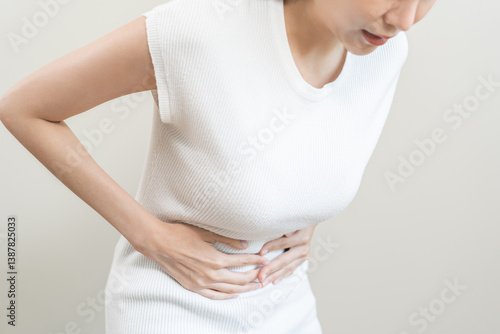 Wallpaper Mural Flatulence asian young woman intolerance hand in stomach ache, suffer from food poisoning, abdominal pain and colon problem, gastritis or diarrhoea when at home. Patient belly, abdomen or inflammation Torontodigital.ca