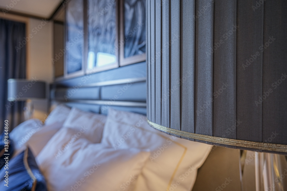 Luxurious ocean view or oceanview or outside balcony veranda cabin stateroom suite queen king double bed on luxury ocean liner cruiseship cruise ship in classic classy interior Art Deco style design