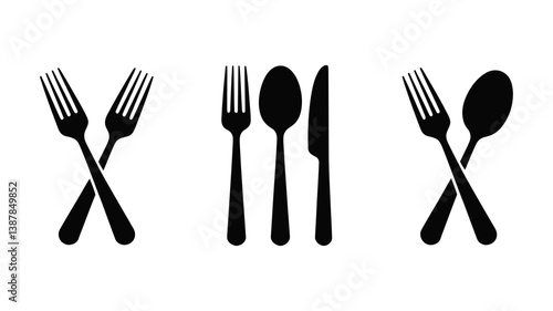 Cutlery Arrangement: A minimalist, artistic collection of black forks, spoons, and knives on display. Designed for kitchen and eating concepts. 