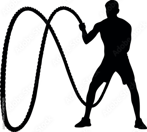 Silhouette Of A Muscular Man Exercising With Battle Ropes During A Fitness Workout Creating Energy And Power In A Sport Concept