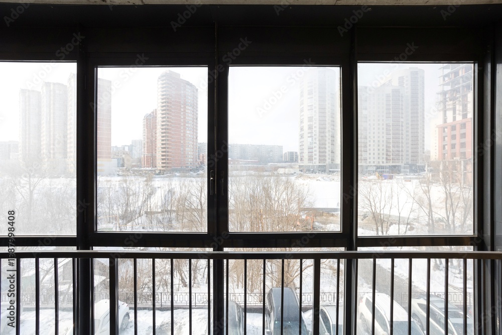 Fototapeta premium the balcony of an apartment on the upper floors of an apartment building
