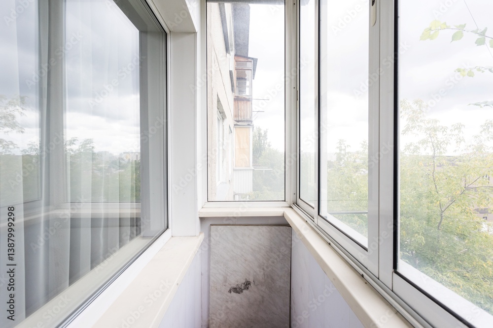 Fototapeta premium the balcony of an apartment on the upper floors of an apartment building