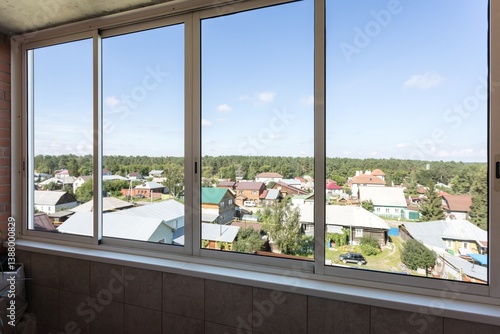 the balcony of an apartment on the upper floors of an apartment building