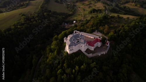 Monumental medieval castle at sunset, beautiful breathtaking drone shot. Lupčiansky hrad, Slovakia. 