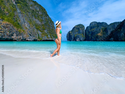 Young caucasian female enjoying pristine beaches of maya bay in island Phi Phi Leh, Thailand