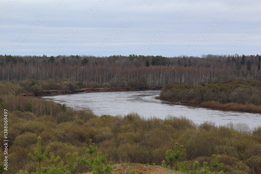 Vyatka river flowing in the forest of north-eastern Europe on a spring day Vyatka river flowing in the forest of north-eastern Europe on a spring day