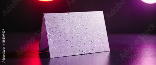 Futuristic business card mockup on reflective surface, stylish branding