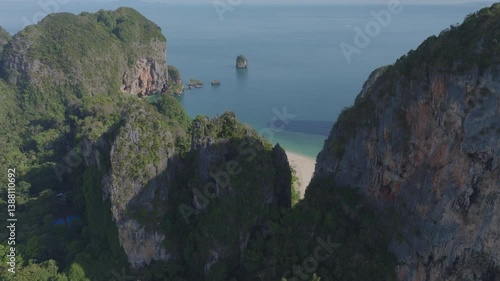 drone shot of a beach with crystal clear blue water in Krabi, Thailand. Railay Beach.