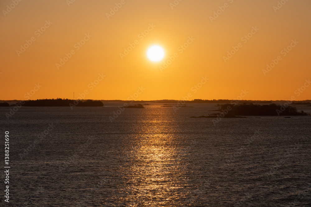 Golden sunset over the islands of the Stockholm archipelago in the Baltic Sea, Sweden. Golden sunset over the islands of the Stockholm archipelago in the Baltic Sea, Sweden.