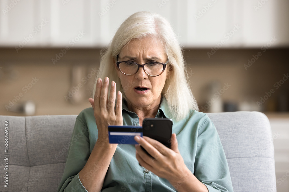 Financial loss fear. Nervous worried senior lady hold credit card look ...