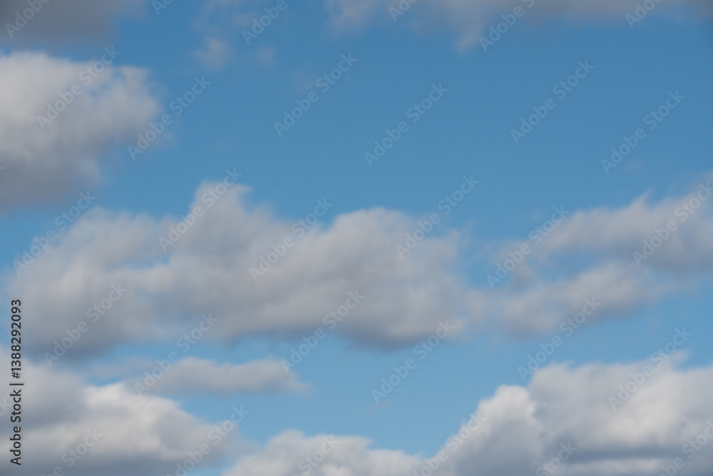 Blue sky with white cumulus clouds, an ideal natural background or texture for design and projects. Blue sky with white cumulus clouds, an ideal natural background or texture for design and projects.