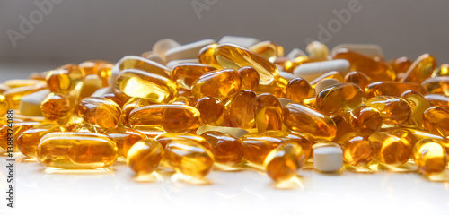 Mix of white medical pills magnesium and capsules omega on white background. Medicinal treatment. Taking dietary supplements. Vitamins and herbal supplements. High quality photo