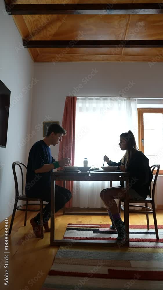 Two close friends have a lighthearted conversation in a bright, inviting dining space Two close friends have a lighthearted conversation in a bright, inviting dining space