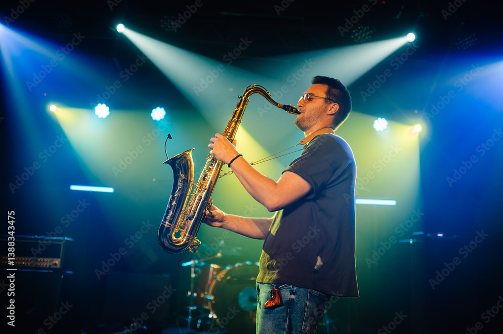 Samolepka Saxophonist performing live on stage with spotlights