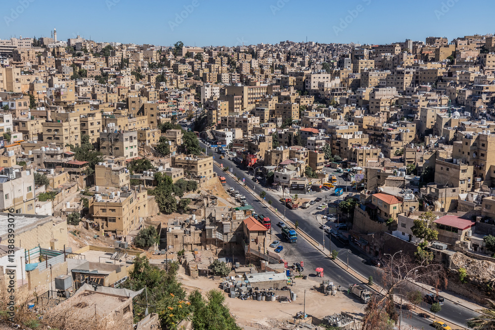AMMAN, JORDAN - JULY 8, 2022: Houses on a steep slope in Amman downtown, Jordan.