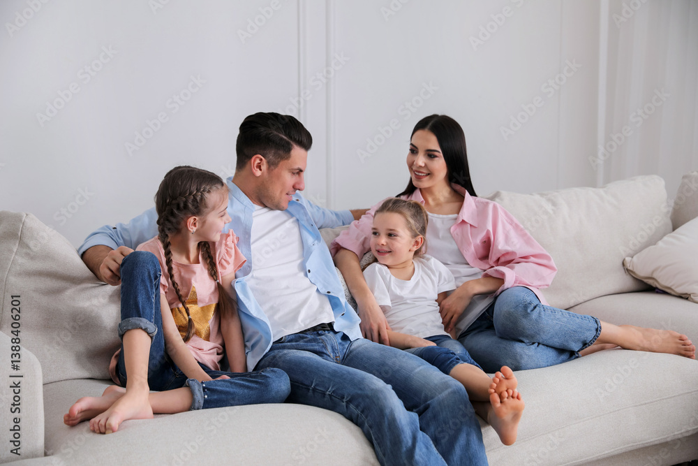 Happy family resting on comfortable sofa in living room Happy family resting on comfortable sofa in living room