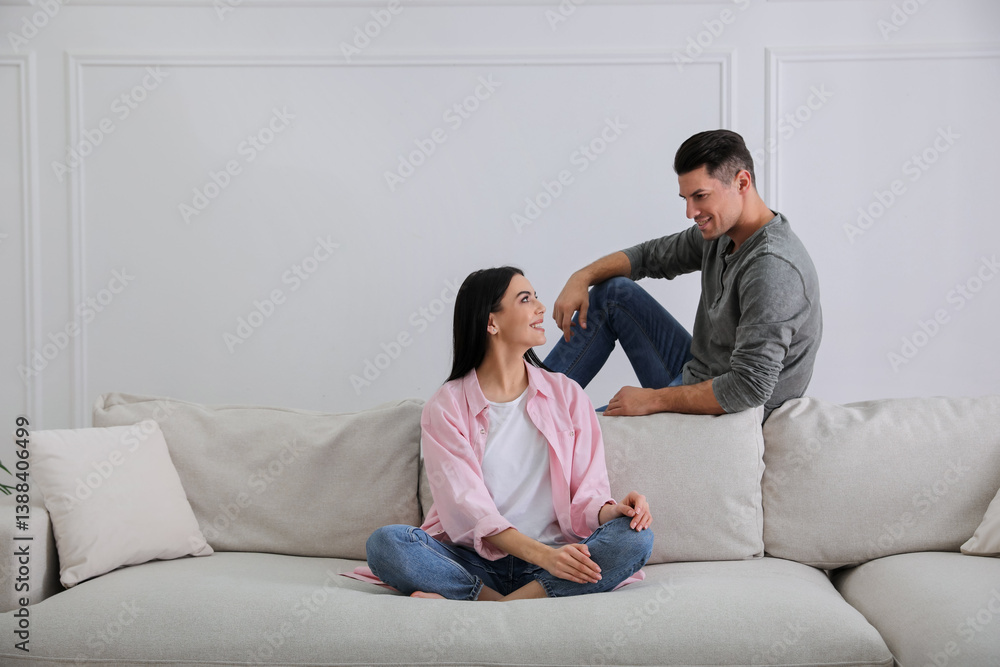 Couple in living room with comfortable sofa