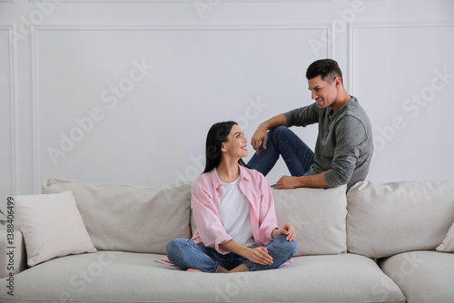 Obraz na płótnie Couple in living room with comfortable sofa w salonie