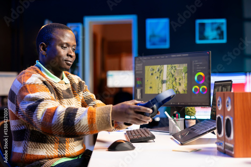 Videography specialist editing new movie clip for video montage, working on freelance contract for post production agency. Creative designer adjusting contrast and exposure using toolbar panels.