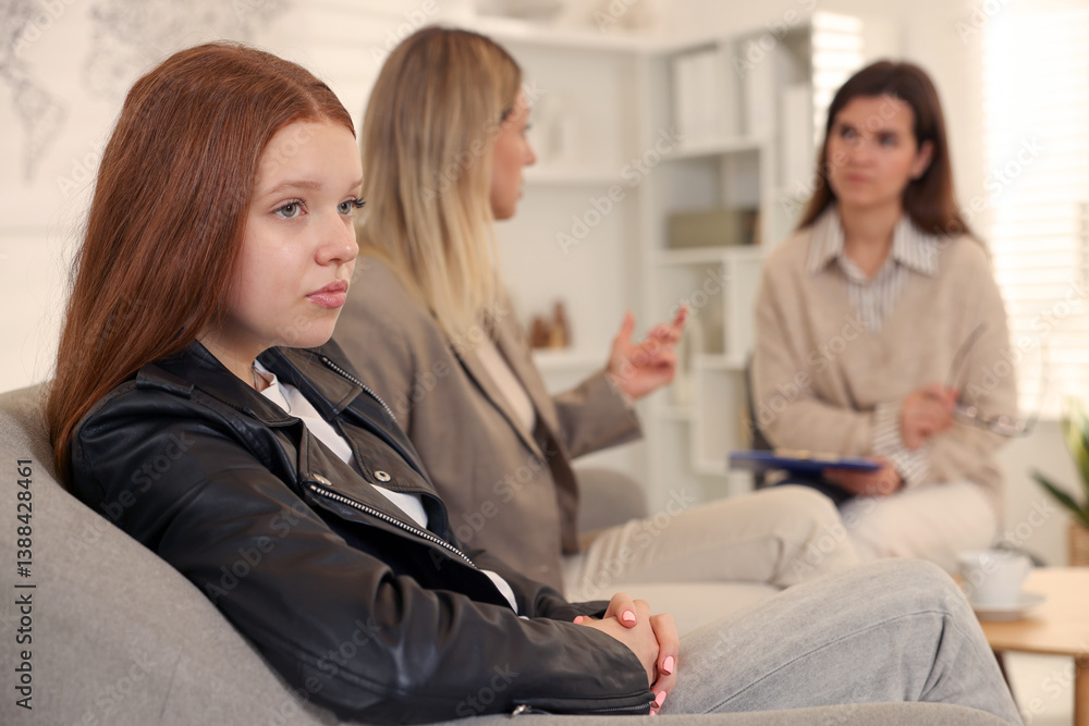 Difficult teenager. Mother and daughter having consultation with psychologist in office, selective focus Difficult teenager. Mother and daughter having consultation with psychologist in office, selective focus