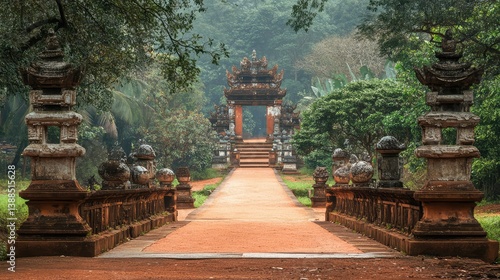 Obraz na płótnie Empty pathway leading to temple gate, flanked by stone lanterns and surrounded by trees, calm setting with room for text w salonie