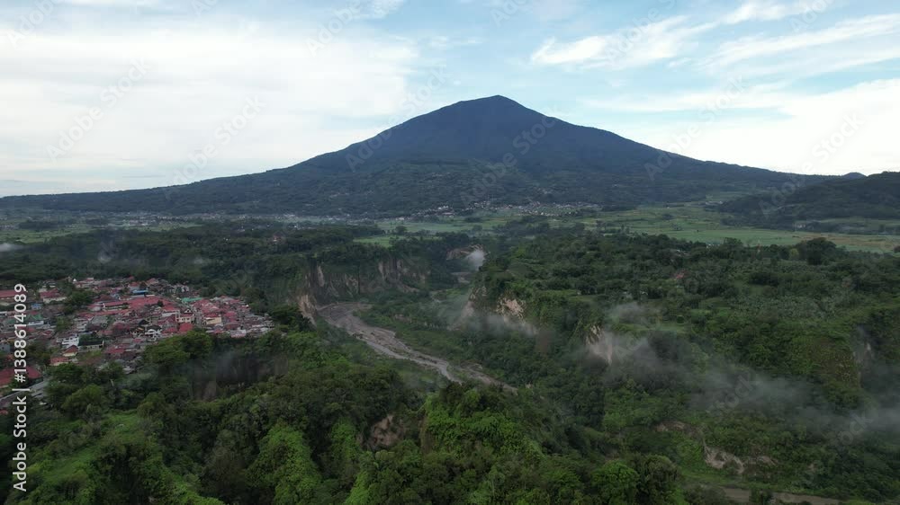 Bukittinggi, West Sumatra - April 13, 2024 : Aerial view of Jam Gadang Bukittinggi, Revealing Its Surroundings. A clock tower, a major landmark, and a tourist attraction in the city of Bukittinggi. Bukittinggi, West Sumatra - April 13, 2024 : Aerial view of Jam Gadang Bukittinggi, Revealing Its Surroundings. A clock tower, a major landmark, and a tourist attraction in the city of Bukittinggi.