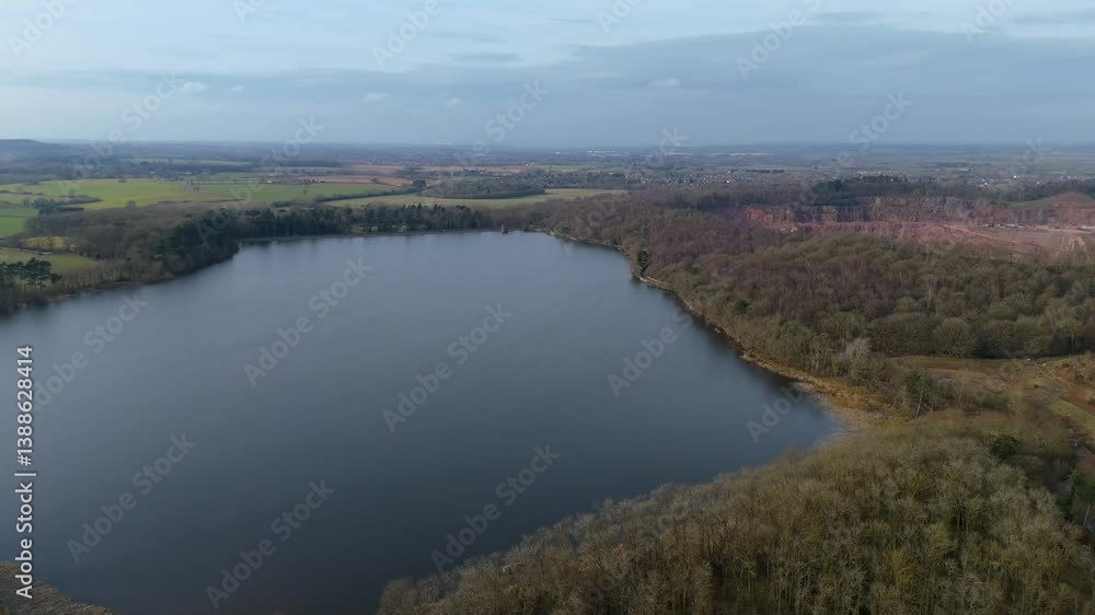Stunning aerial view of a large reservoir surrounded by forests and quiet countryside, UK. Stunning aerial view of a large reservoir surrounded by forests and quiet countryside, UK.